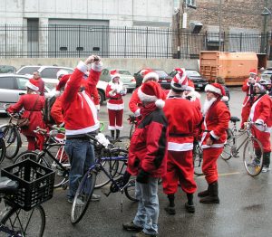 Santas on bikes, winter in Chicago. Photo by by Dubi Kaufmann,